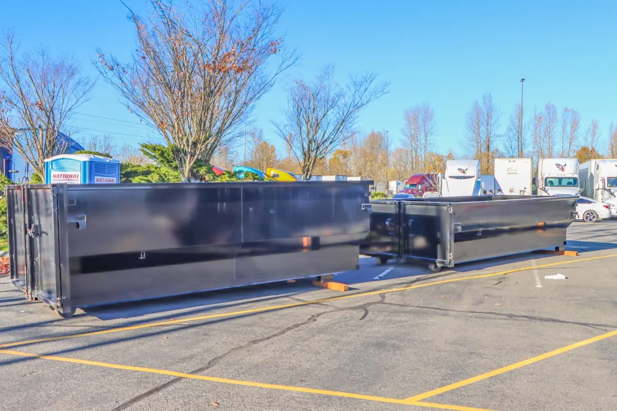 Professional dumpster rental service with roll-off container on residential driveway in Orland Hills